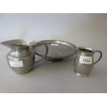 Tudric pewter hand beaten cream jug, No. 01635, another smaller Tudric cream jug, No. 01384 and a