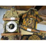 Reproduction Dutch style wall clock together with a reproduction Swiss cuckoo clock