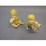 Two Royal Worcester porcelain prototype figures of children seated and crawling No back stamps. Some