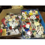 Two boxes containing a large collection of various 20th Century match books and boxes