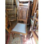 Set of four Continental oak Arts and Crafts slat back dining chairs with upholstered seats, raised