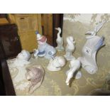 Group of eight various small Lladro figures