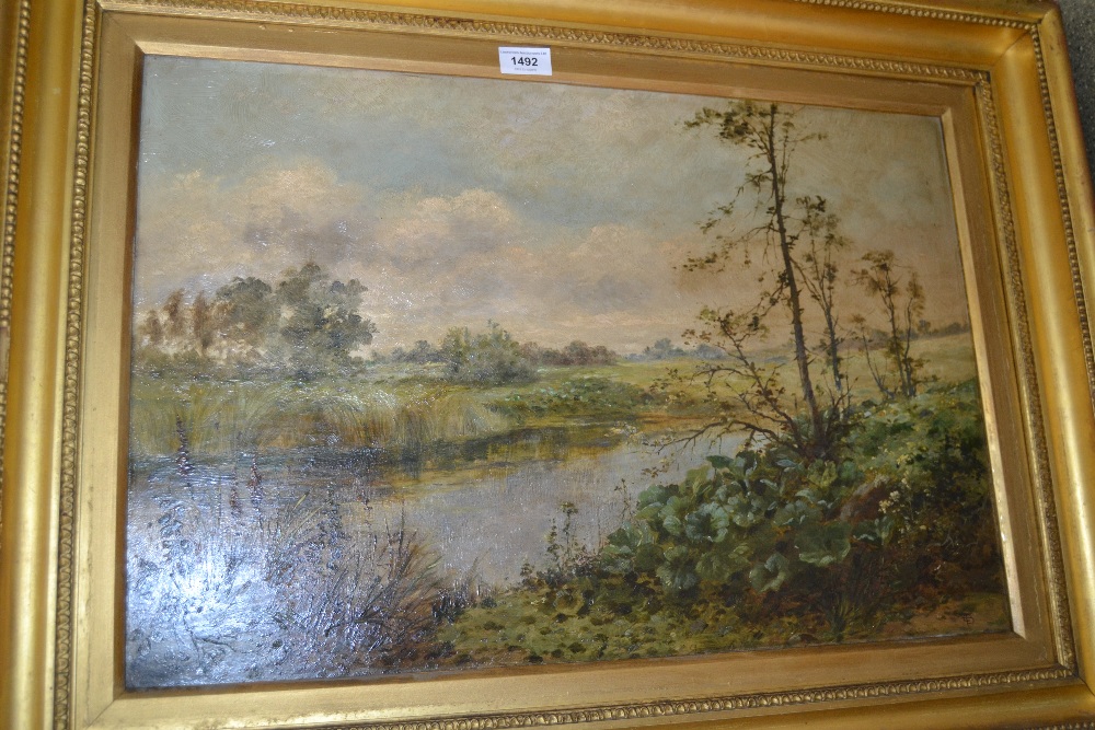 19th Century oil on canvas, extensive river landscape, monogrammed, 16ins x 24ins