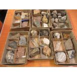 Six boxes containing a collection of various mineral stone samples