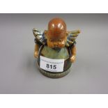 Royal Doulton stoneware inkwell in the form of a baby, impressed marks to base (damage to hinge
