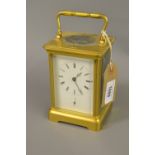 Late 19th / early 20th Century gilt brass cased carriage clock, the enamel dial with Roman