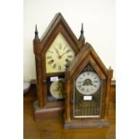Two late 19th Century Gothic style cased Continental mantel clocks with glazed doors and painted