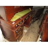 Late 19th early 20th Century mahogany twin pedestal desk having an arrangement of nine drawers