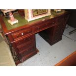 Late 19th or early 20th Century mahogany twin pedestal desk, the green leather inset top above