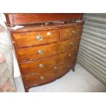 Regency mahogany bow front chest of two short and three long drawers with oval brass handles and