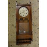 Late 19th Century walnut wall clock, the circular enamel dial inscribed Garlick Newbury with a