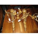 Pair of carved giltwood three branch wall sconces (at fault)