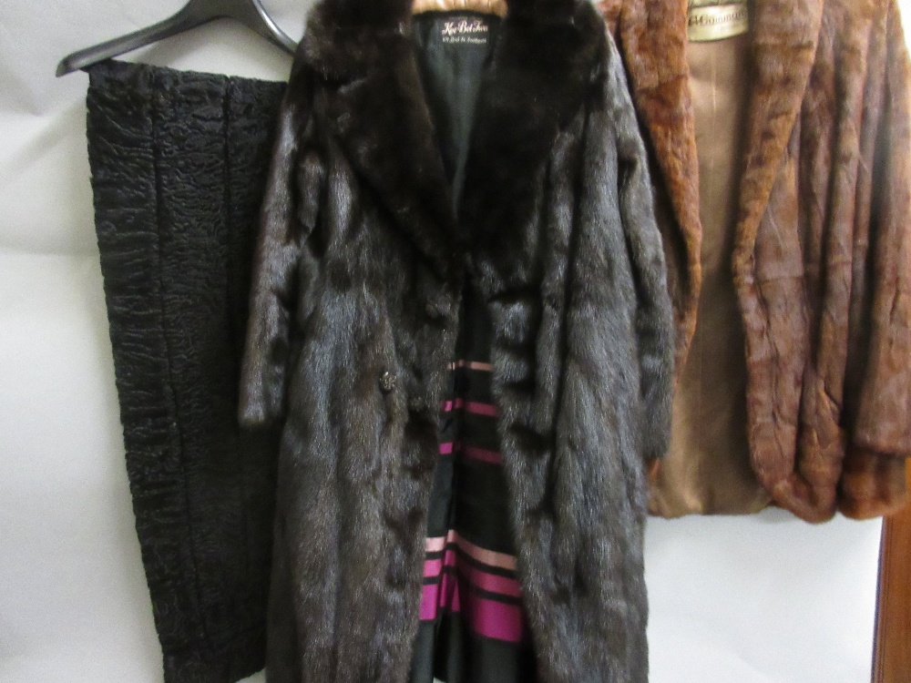 Ladies medium brown fur jacket (at fault), a lambs wool shawl, a three quarter length dark brown fur