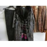 Ladies medium brown fur jacket (at fault), a lambs wool shawl, a three quarter length dark brown fur