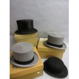 Three various boxed 20th Century top hats and an unboxed Dunn & Co bowler hat 16.5cm wide (side to