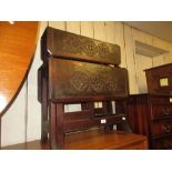 Arts and Crafts oak four tier Sutherland table carved with Celtic emblems