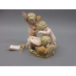 19th Century Meissen group of three gambling cherubs, 6ins high