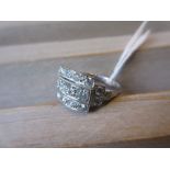 Art Deco style diamond and platinum ring set three bands of graduated brilliant cut stones, the