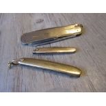 Small 18ct gold mounted and steel penknife, a similar 14ct gold miniature penknife and a 9ct gold