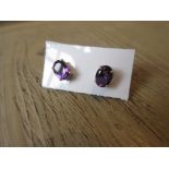 Pair of silver amethyst set stud earrings Estimate of £50 - 80