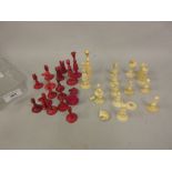 19th Century natural and red stained ivory part chess set (some damages and losses)