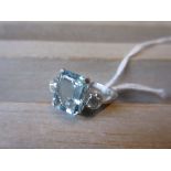 Aquamarine and two stone diamond set ring, the aquamarine of approximately 3ct, the round