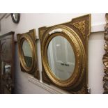 Pair of oval gilt moulded composition wall mirrors (one at fault) Some losses to moulding on one