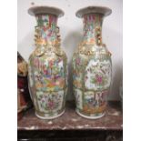 Pair of large 19th Century Canton famille rose baluster form vases decorated with panels of figures,