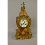 19th Century French gold lacquer and gilt brass mounted two train mantel clock, the enamel dial with