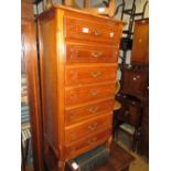 20th Century French cherry wood semainier , the moulded parquetry inlaid top above seven drawers