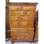 George I walnut tallboy, the moulded cornice above two short and six long drawers with brass handles