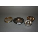 Group of five small silver coin inset bowls, a Russian silver coin inset bowl, another small