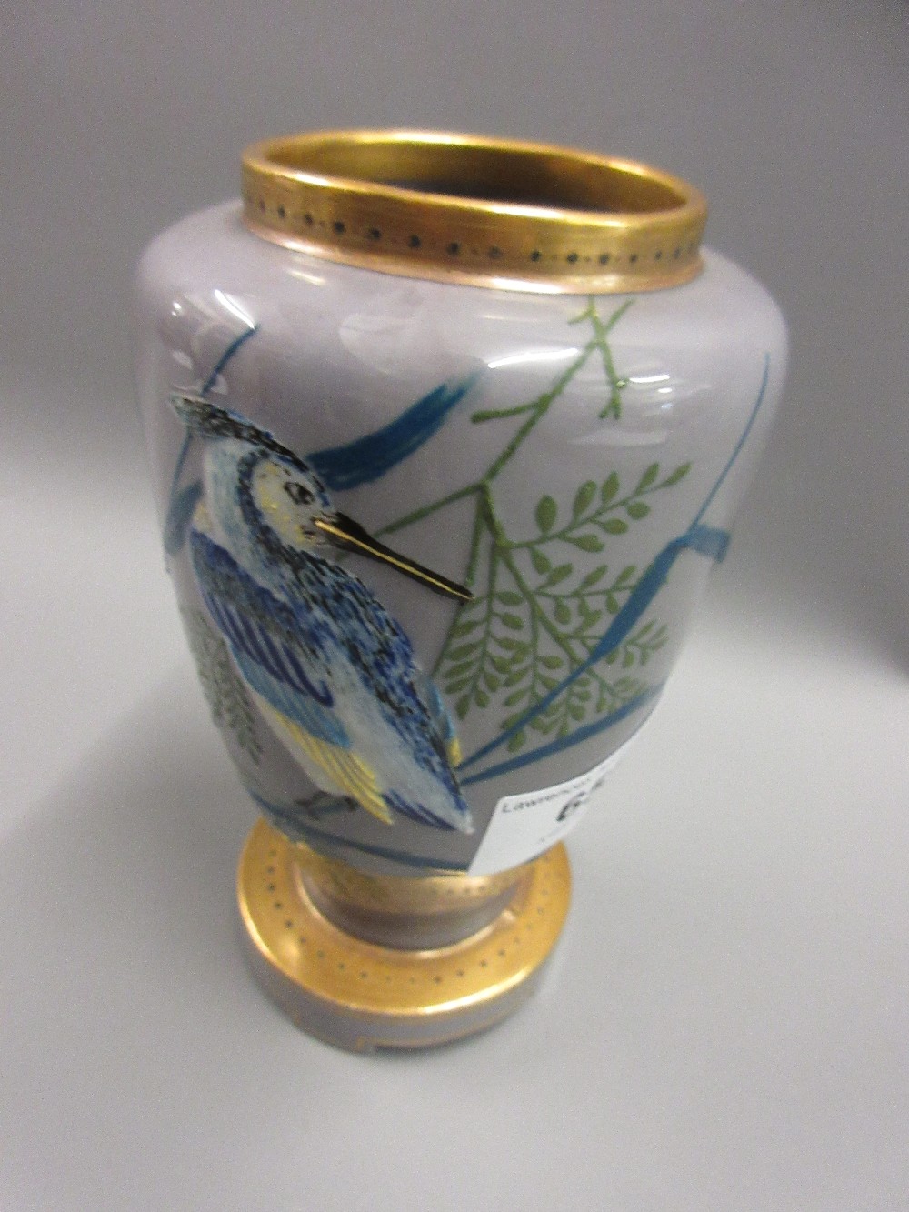 Small Mintons pate sur pate ovoid vase decorated with a bird and foliage on a mauve ground,