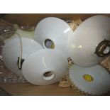 Four circular white opaque glass lamp shades