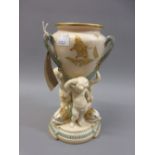 19th Century Copeland vase supported by three puti, 9ins high Chip to foot and restoration to two of