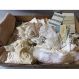 Box containing a quantity of various hand made and machine made lace