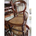 Pair of Victorian balloon back bedroom chairs with cane seats, together with a rectangular stool