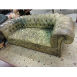 Large green button leather upholstered chesterfield sofa, raised on low bun feet Has been re-
