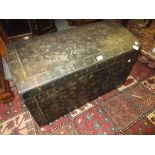 18th / 19th Century black lacquer dome top trunk with hinged lid and brass end carrying handles