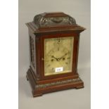 Late 19th / early 20th Century bracket clock, the mahogany case with carved and reeded decoration,