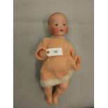 Armand Marseille, bisque headed baby doll with fixed eyes, open mouth and two teeth, marked 351/4.