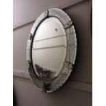 Oval Venetian style clear glass mirror with floral etched border and a modern rectangular wall