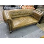 Small late 19th Century green button upholstered leather Chesterfield sofa, on turned front supports