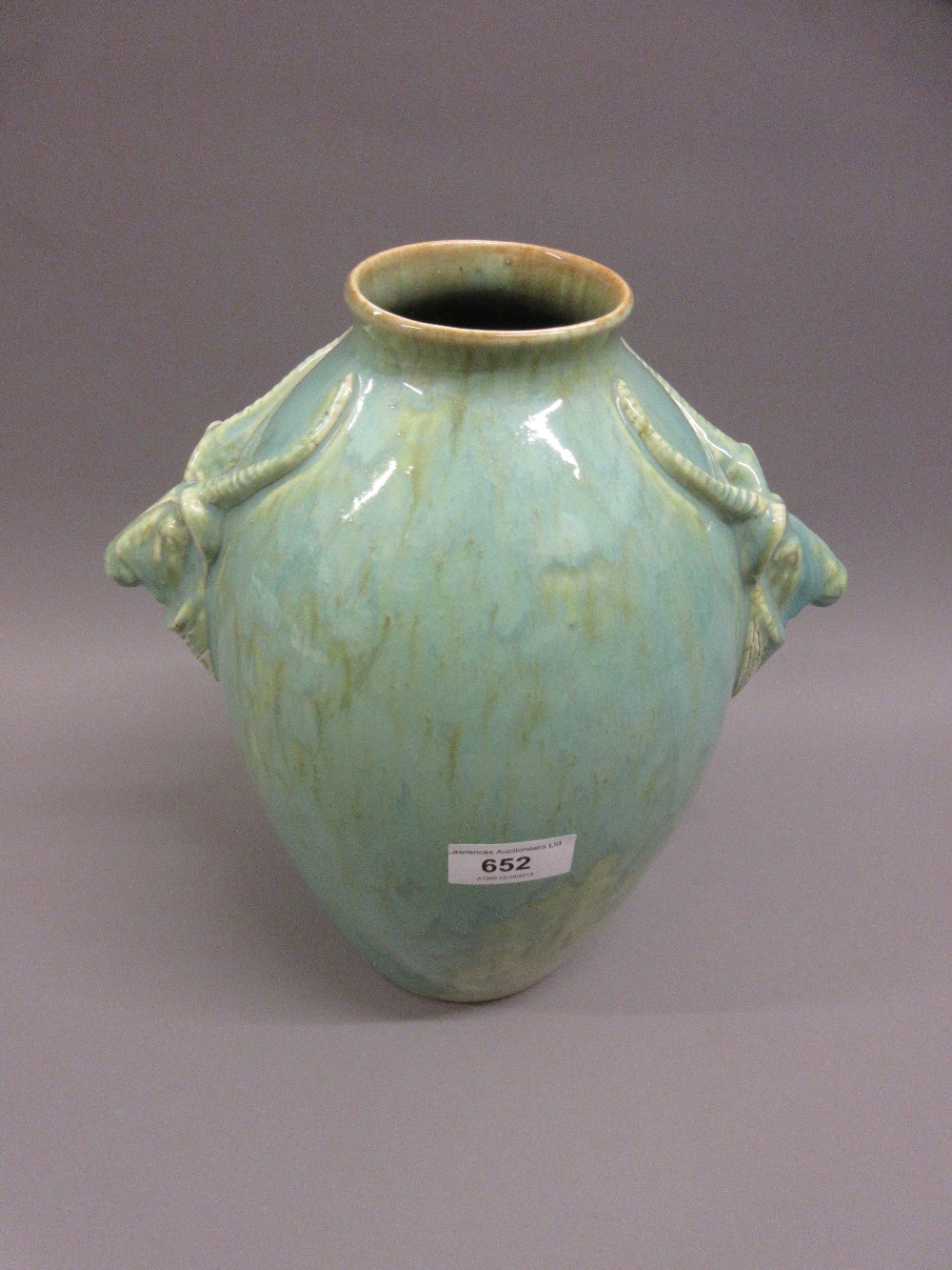 Large Ashtead pottery vase of ovoid form, the side handles in the form of antelope, decorated with