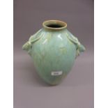 Large Ashtead pottery vase of ovoid form, the side handles in the form of antelope, decorated with