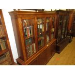 Reproduction yew wood four door bookcase, a matching breakfront sideboard and a matching dining