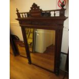 19th Century French oak overmantel mirror with a shaped surmount above a rectangular plate,