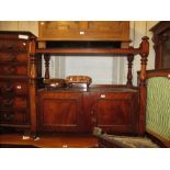 Victorian mahogany buffet with two panel doors raised on low turned feet