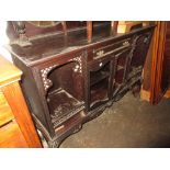 19th Century mahogany credenza having mirrored single shelf back on turned supports with bevelled