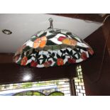 Tiffany style leaded glass lamp shade together with a wrought iron lamp standard with shade